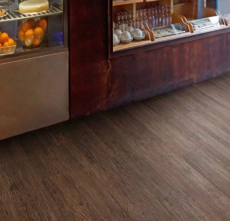 TLC Massimo Wood Hickory 5268 captures the natural charm of hickory with its detailed wood-effect design and authentic grain textures. This luxury vinyl flooring offers the perfect balance of style and functionality, delivering a durable, low-maintenance solution for both residential and commercial spaces. Its robust construction ensures lasting beauty, making it an ideal choice for creating a warm and inviting atmosphere in any room.